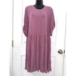 Discount Divas plum-colored, knee-length dress with a relaxed, flowy silhouette